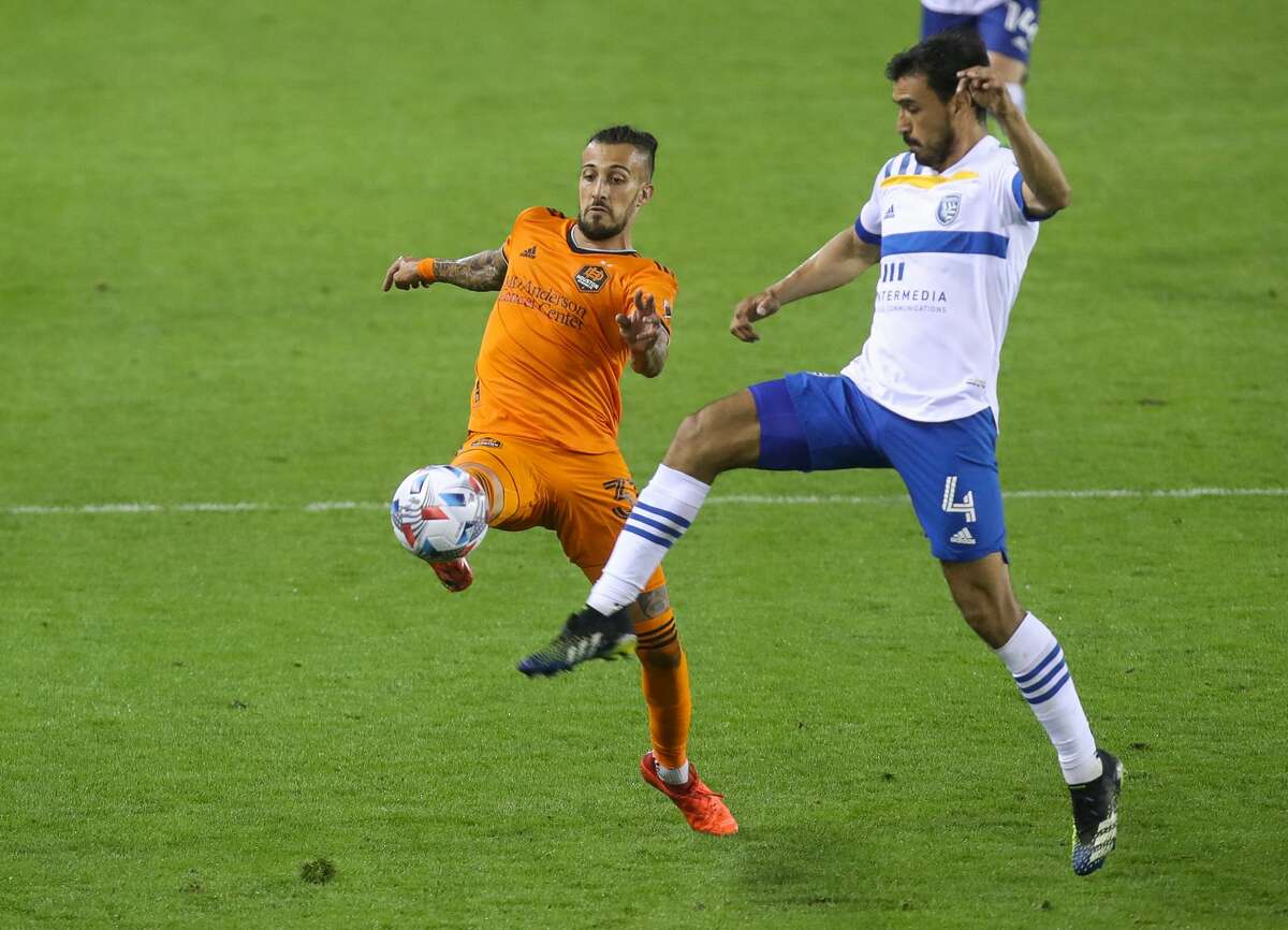 Houston Dynamo FC forward Maximiliano Urruti (37) gets to the ball before San Jose Earthquakes defender Oswaldo Alanis (4) during the second half of an MLS match at BBVA Stadium on Friday, April 16, 2021, in Houston. The Dynamo won 2-1.