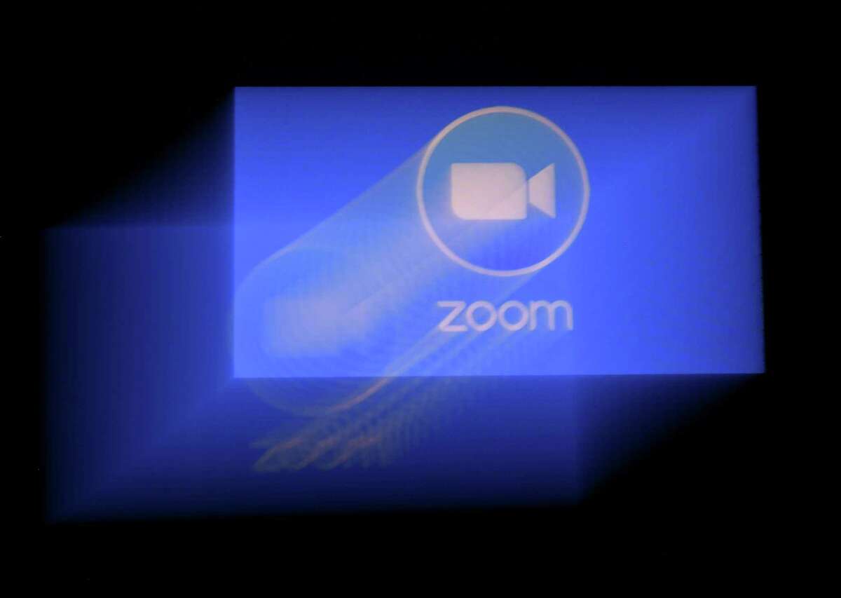(FILES) In this file photo illustration taken on March 29, 2020, Zoom app logo is displayed on a smartphone on March 30, 2020, in Arlington, Virginia. - Zoom, which has seen its popularity skyrocket in the coronavirus pandemic, is in hot water after users complained to the FBI of being startled by porn during meetings. New York Attorney General Letitia James sent a letter to the in-vogue California enterprise "with a number of questions to ensure the company is taking appropriate steps to ensure users' privacy and security," a spokesman said. (Photo by Olivier DOULIERY / AFP) (Photo by OLIVIER DOULIERY/AFP via Getty Images)