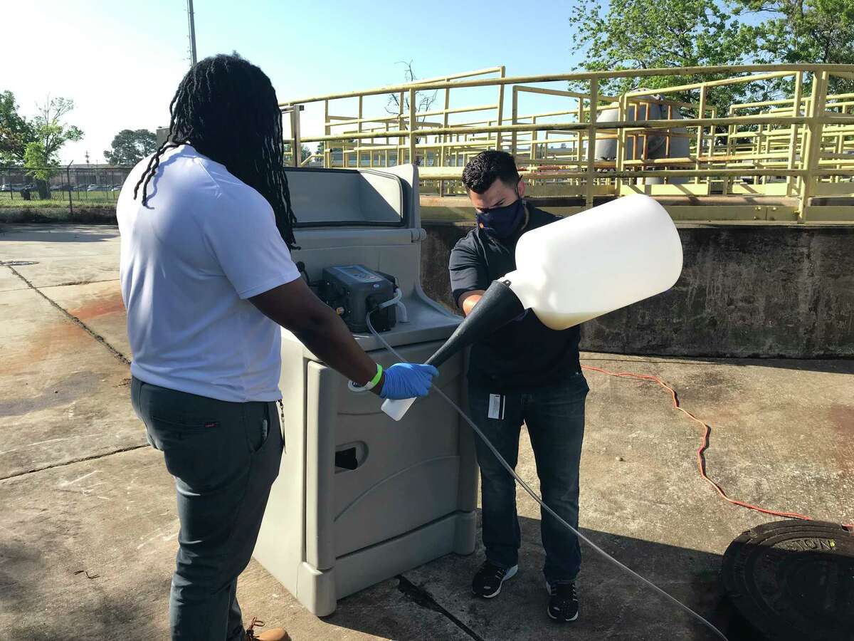 City of Houston public works employees handle wastewater samples at various lift stations and manholes in the city. The wastewater is analyzed to detect sars-COV-2.