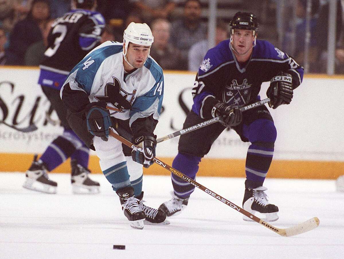 The Sharks’ Patrick Marleau skates out in front of the Los Angeles Kings’ Glen Murray on Nov. 18, 1998, at San Jose Arena.