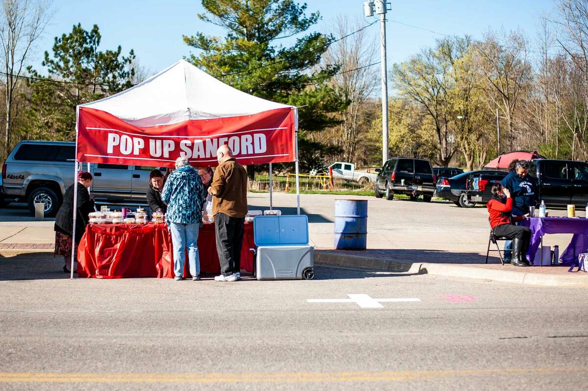 Shoppers peruse the Pop Up Sanford market on April 17, 2021.