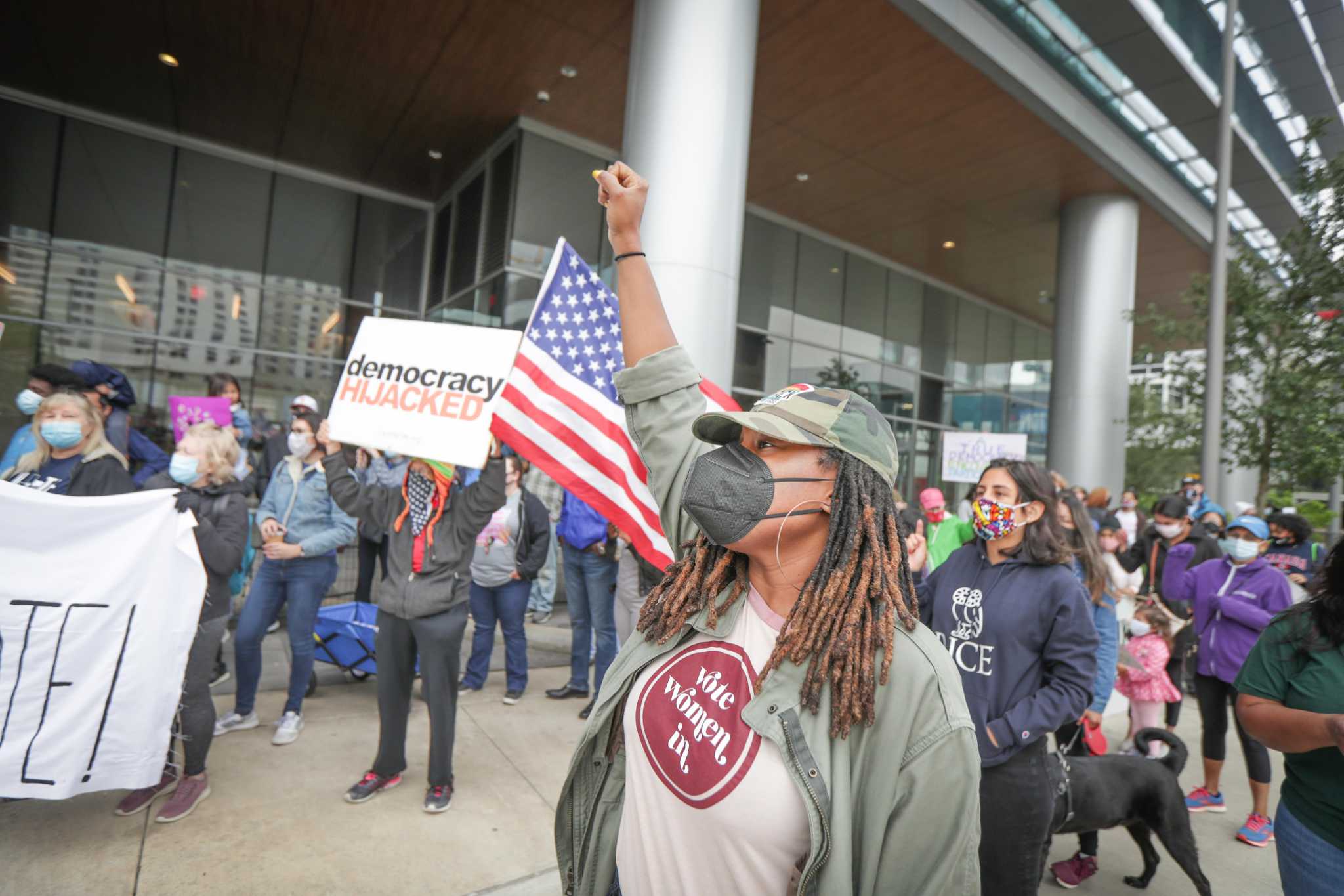 Activists protest Texas’ voter bills at Greater Houston Partnership