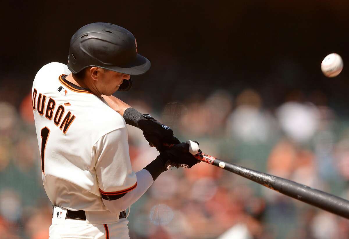 SAN FRANCISCO, CALIFORNIA - APRIL 14: Mauricio Dubon #1 of the San Francisco Giants hits a single that scored in a run in the eighth inning against the Cincinnati Reds at Oracle Park on April 14, 2021 in San Francisco, California. (Photo by Ezra Shaw/Getty Images)