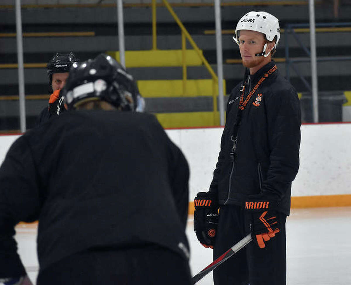 In this file photo, Edwardsville High School ice hockey coach Jason Walker watches over his team during a drill inside the East Alton Ice Arena.