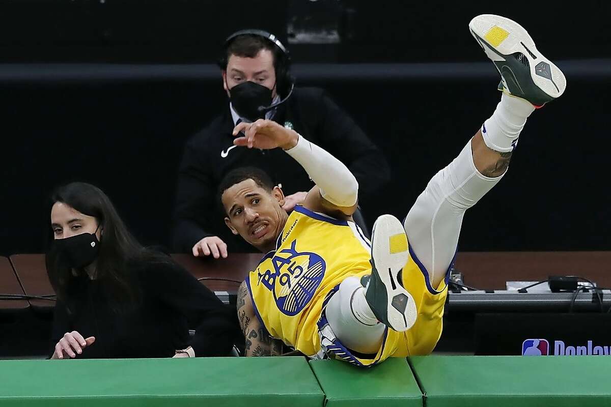 Golden State Warriors' Juan Toscano-Anderson goes out of bounds after chasing the ball during the second half of an NBA basketball game against the Boston Celtics, Saturday, April 17, 2021, in Boston. (AP Photo/Michael Dwyer)