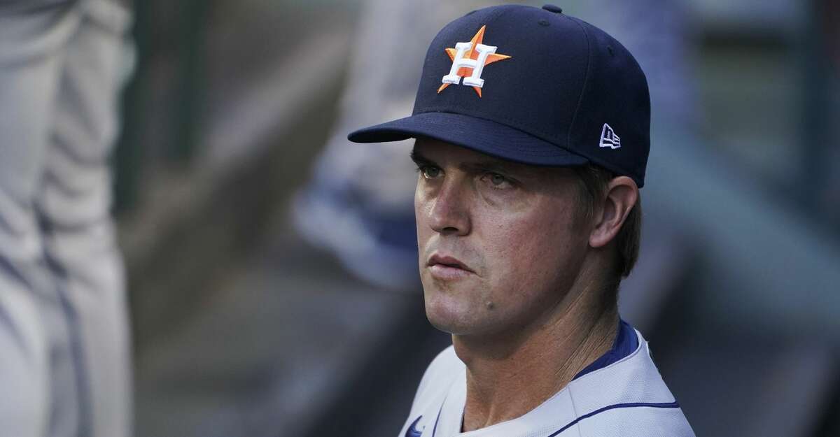 Houston Astros starting pitcher Zack Greinke looks out from the dugout before the team's baseball game against the Seattle Mariners, Saturday, April 17, 2021, in Seattle. Greinke threw eight innings of shutout ball, giving up four hits, before Ryan Pressly closed out the game in the ninth. The Astros won 1-0. (AP Photo/Ted S. Warren)