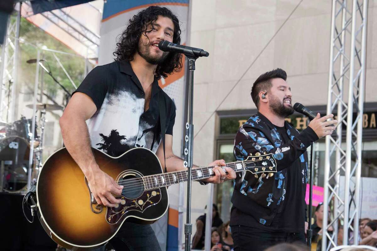 FILE - Dan Smyers, left, and Shay Mooney from the band Dan + Shay perform on NBC's Today show in New York on June 28, 2019. The duo will perform at Sunday's Academy of Country Music Awards. (Photo by Charles Sykes/Invision/AP, File)