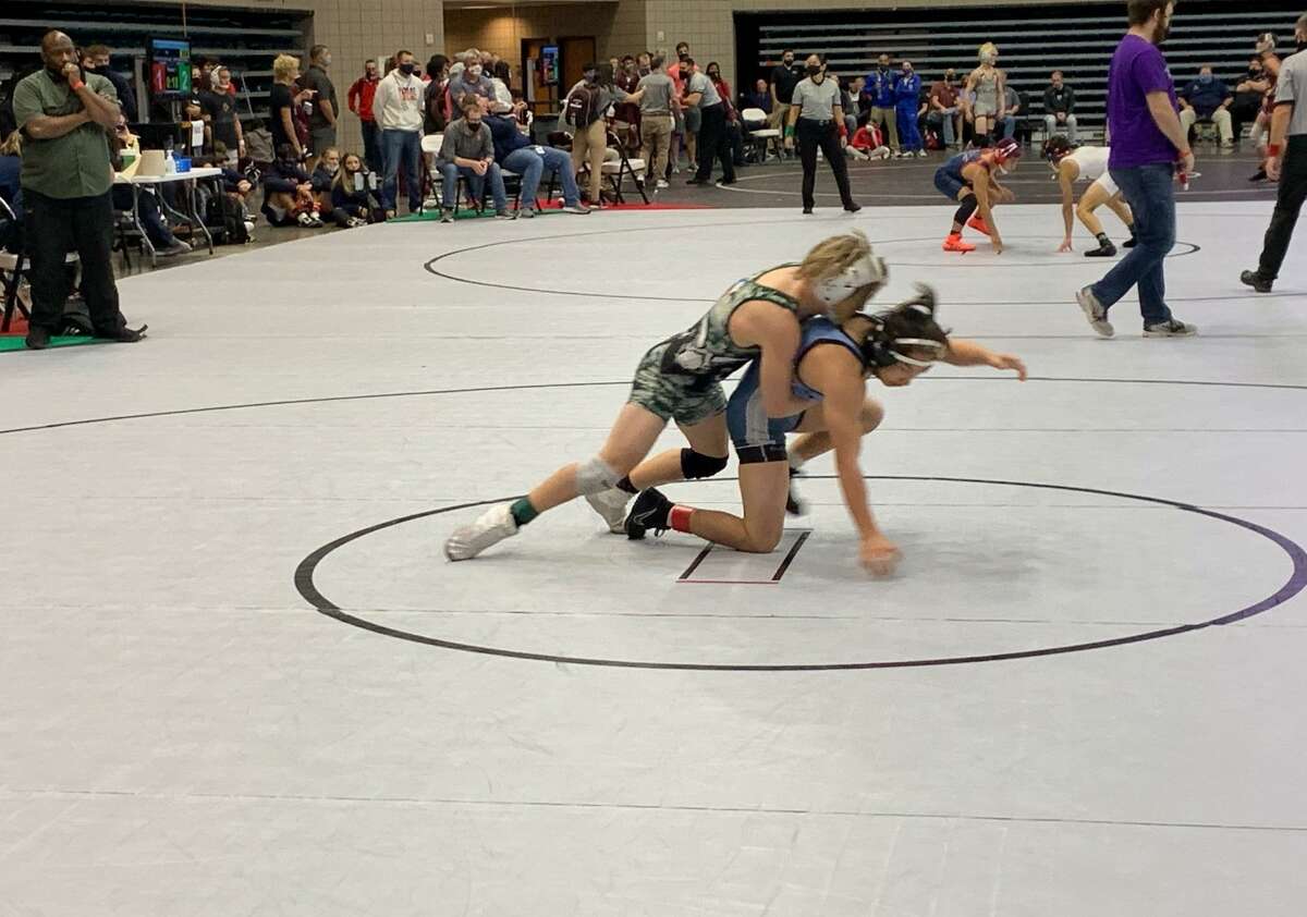 Mayde Creek's Ty Freguson and Brazoswood's Luc Nguyen compete for the 113-pound bronze medal at the Region III-6A tournament April 17 at Merrell Center.