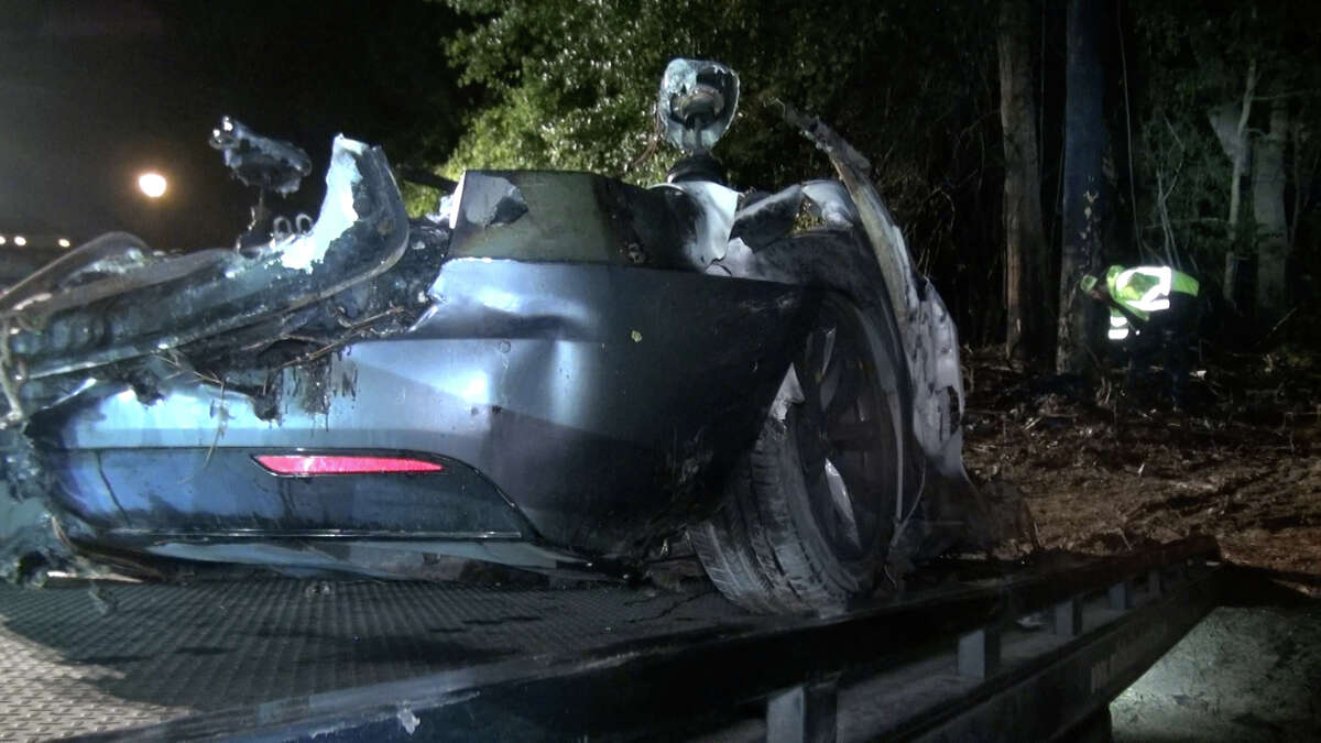 Two people died in a car fire Saturday night, according to the Woodlands Fire Department.