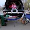 The Dombrow family, of Westport, including from left Matt, Leah, 11, Alexa, 8, and Melissa, enjoy a tailgate at the Remarkable Theater's drive-in showing of "Goonies" on Friday, April 16, 2021, in Westport, Conn.