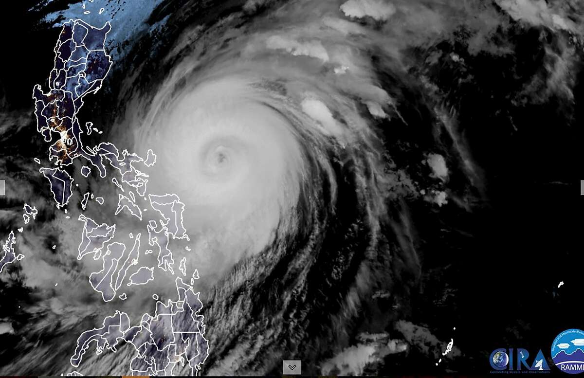 This RAMMB/CIRA handout satellite image shows Super Typhoon Surigae (C) off the eastern coast of the Philippines on April 18, 2021.
