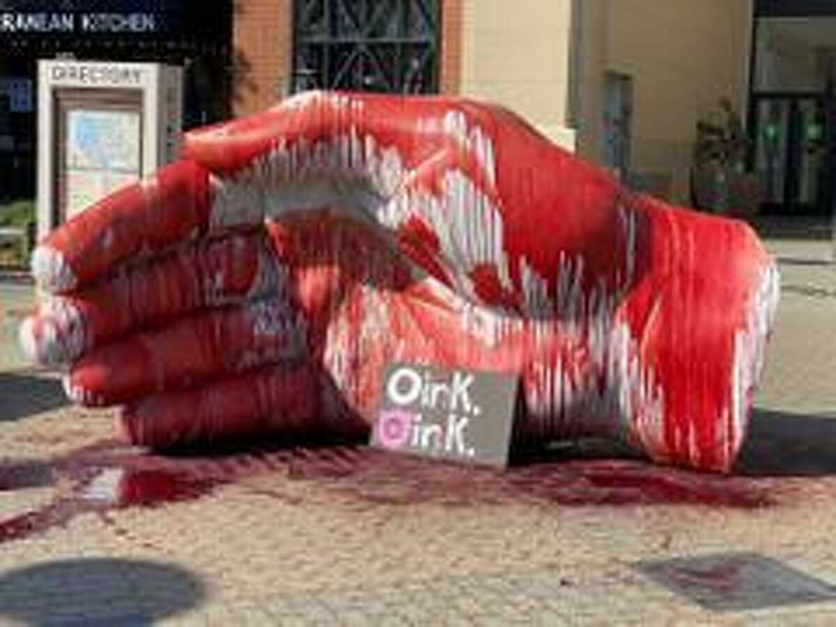A large sculpture of a hand at the entrance of Santa Rosa Plaza was smeared with a substance suspected to be animal blood, police said.