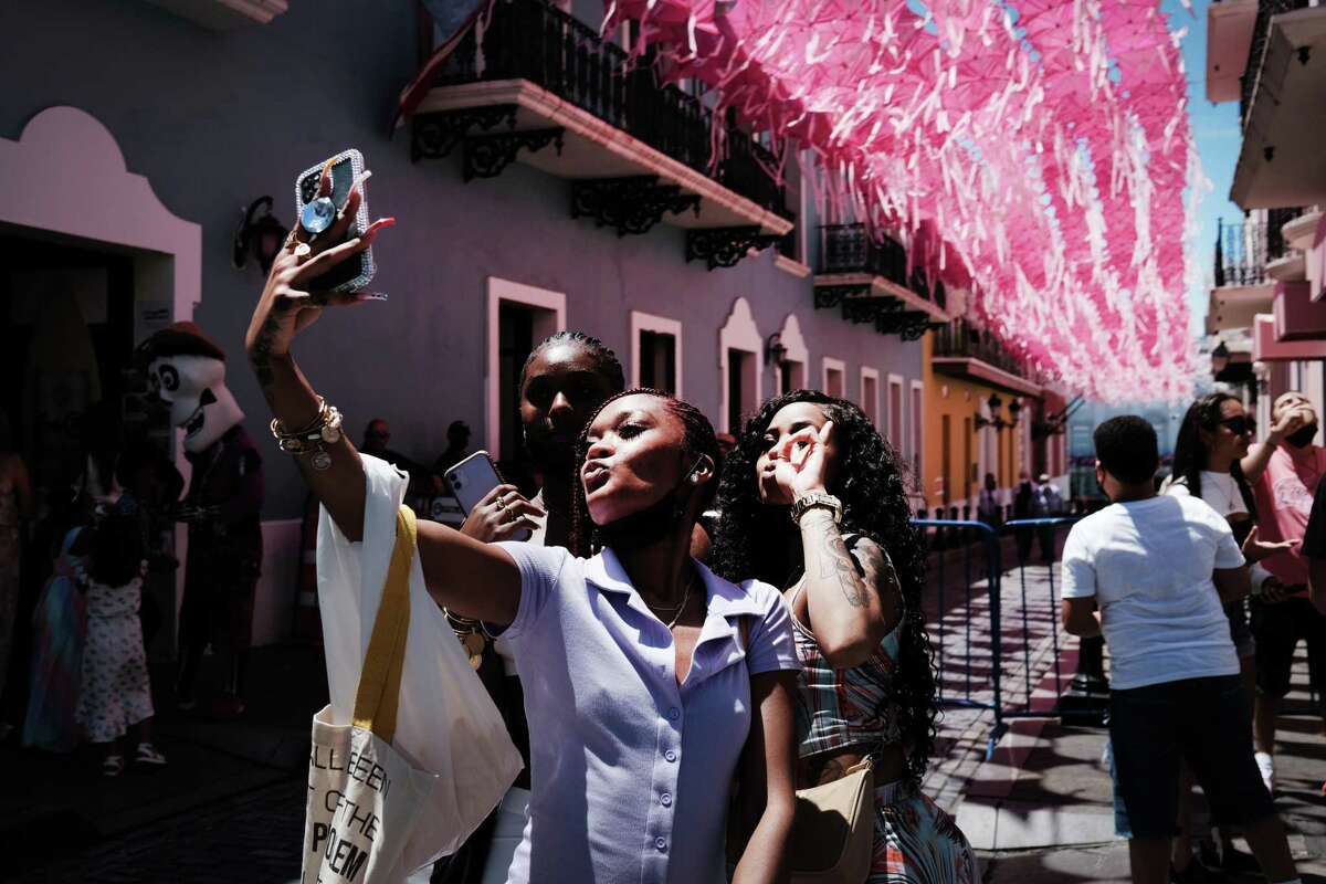 People walk through Old San Juan on March 21, 2021 in San Juan, Puerto Rico.