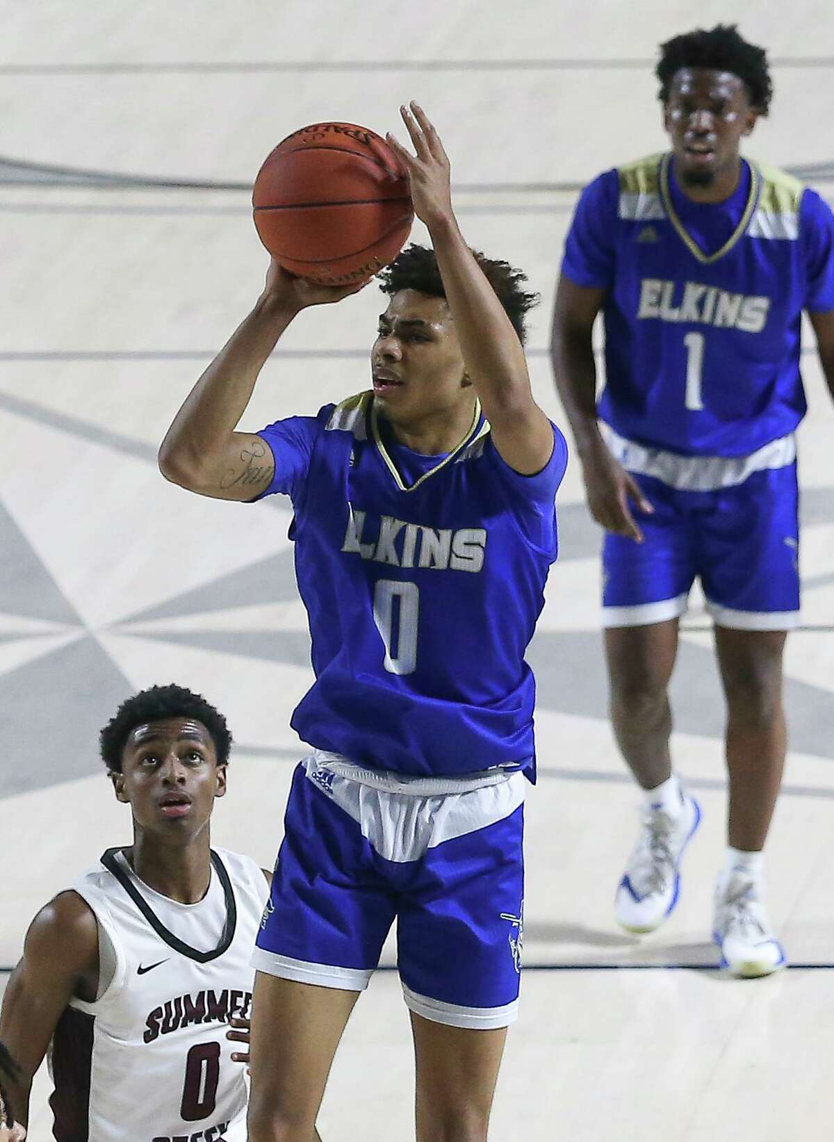 Elkins' Chris Johnson aims for the basket during the second quarter of a UIL 6A Region III Boys Basketball Playoffs Semifinal game against Summer Creek Tuesday, March 2, 2021, at Delmar Fieldhouse in Houston.