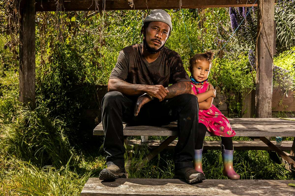 Christoper Renfro with daughter Ahmarie, 3, at Alemany Farm.