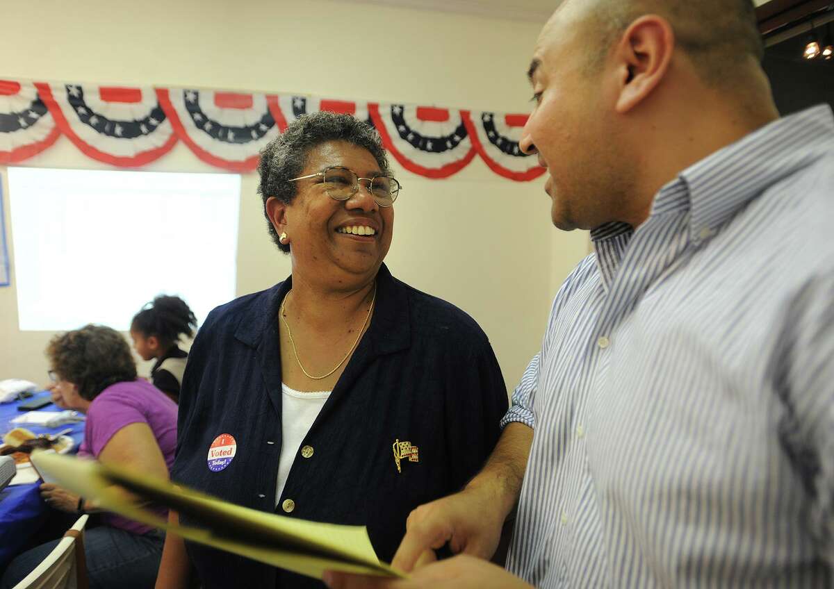 A 2017 file photo showing Stephanie Philips, left, talking with campaign strategist Jalmar DeDios following her victory in the Democratic mayoral primary in Stratford, Conn.