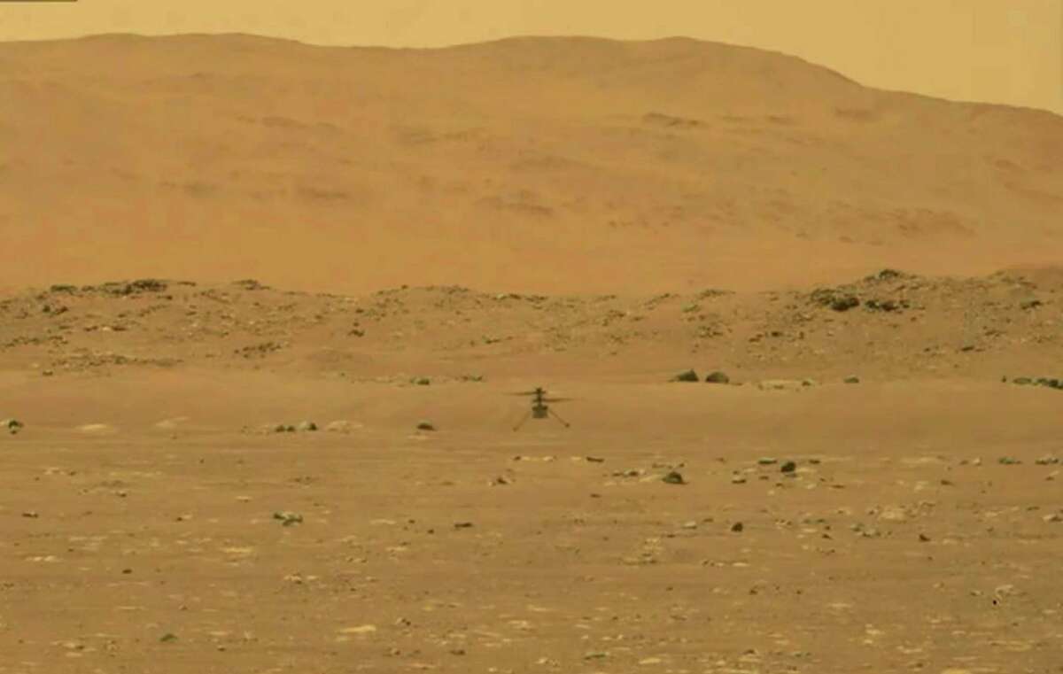 An image provided by NASA during the Ingenuity helicopter’s first flight on Mars, Monday, April 29, 2021, which lasted less than 60 seconds and reached a height of about 10 feet. The brief test of the experimental vehicle shows how explorers can study the red planet from the sky as well as the ground. (NASA via The New York Times) — FOR EDITORIAL USE ONLY.
