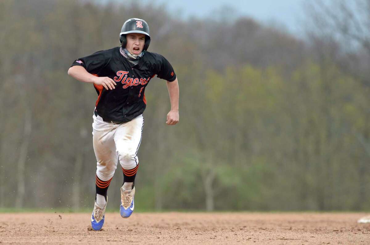Ridgefield's Luke D'Antonio (1) heads to third from second in the boys baseball game between Ridgefield and Danbury high schools, Monday April 19, 2021, at Danbury High School, Danbury, Conn.