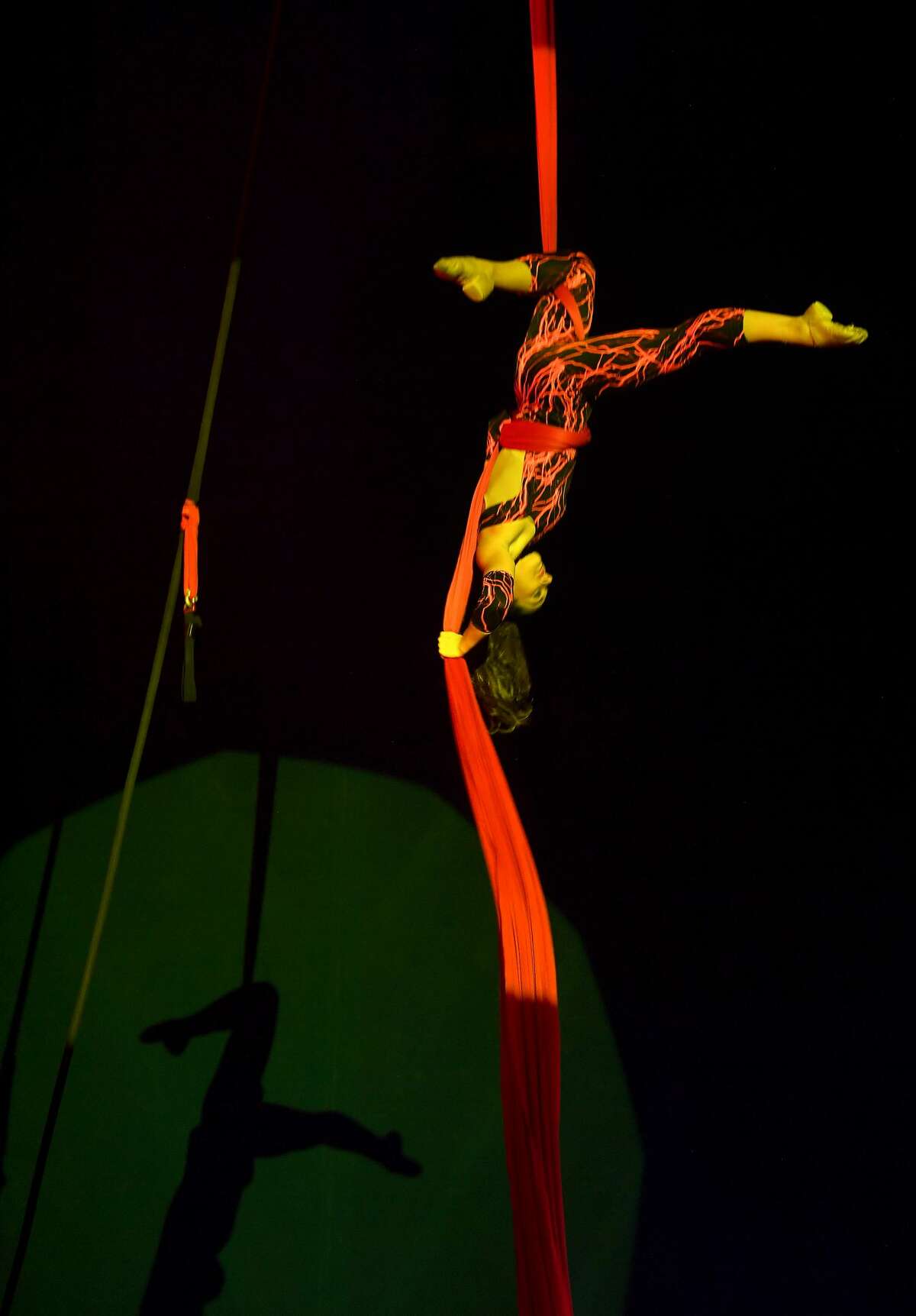 Silks aerialist Susan performs during the Sunday matinee show of Do Portugal Circus at Parkdale Mall. The international circus is in its final week. Showtimes are 7:30 daily through Friday, Saturday at 5 and 8 p.m. and Sunday at 2, 5 and 8 p.m. Photo made Sunday, April 18, 2021 Kim Brent/The Enterprise