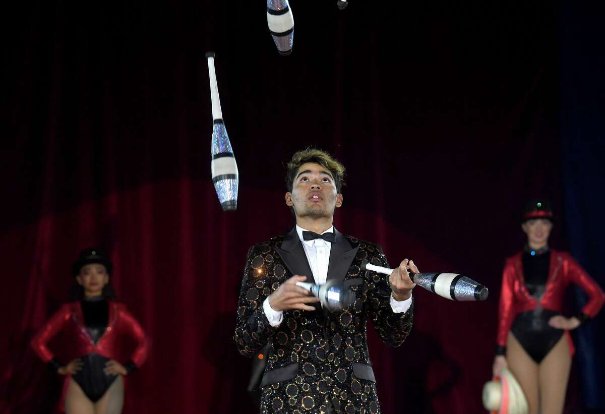 Carlos juggles during the Sunday matinee show of Do Portugal Circus at Parkdale Mall. The international circus is in its final week. Showtimes are 7:30 daily through Friday, Saturday at 5 and 8 p.m. and Sunday at 2, 5 and 8 p.m. Photo made Sunday, April 18, 2021 Kim Brent/The Enterprise