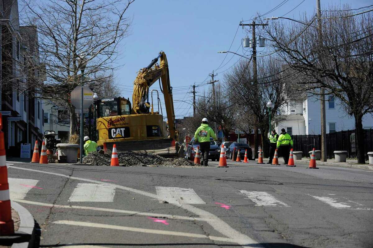 A construction crew works along Stillwater Avenue on Thursday, April 4, 2019 in Stamford, Connecticut. According to the City of Stamford's website, 11 streets are set to be paved this year with Stillwater listed among five streets that are slated to be re-paved in their entirety.