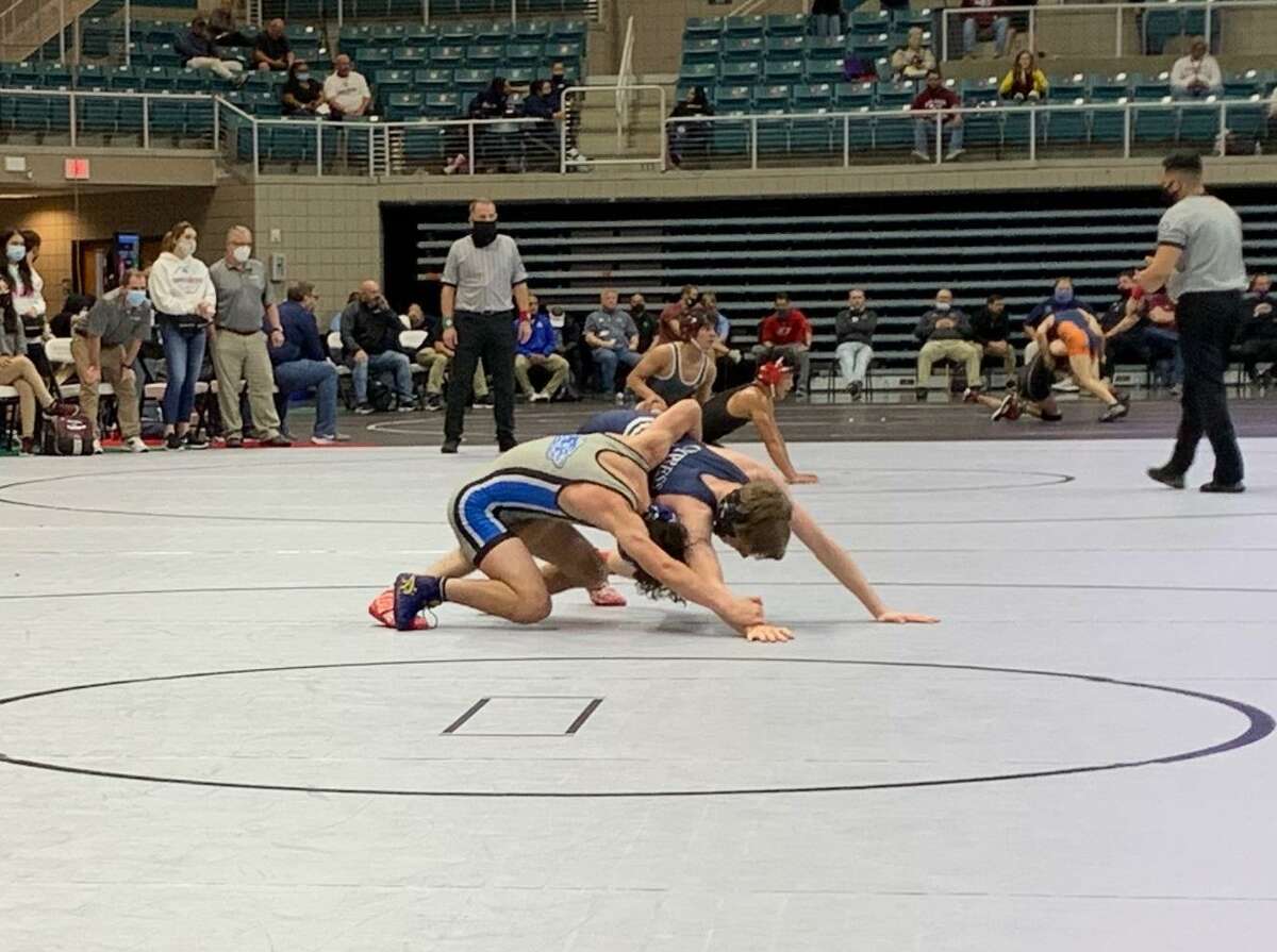 Westside’s Juan Cantu and Cypress Ranch’s Oliver Scoble compete for the 106-pound bronze medal at the Region III-6A tournament April 17 at Merrell Center.