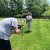 Chris Sinise, of Stratford and a graduate student at Pace University, films a local beekeeper for the documentary "Bee Aware," which premieres online on Earth Day.