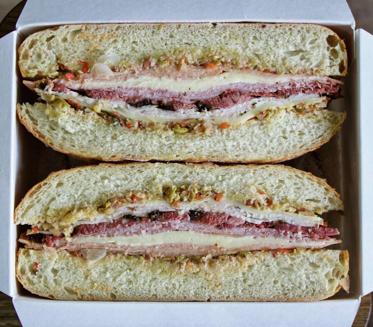Brett's Barbecue Shop in Katy has created its own Texas Smoked Muffuletta made with house-smoked meats (pastrami, turkey breast, bologna and ham), Havarti and Provolone cheeses and hot giardiniera/olive/red pepper salad on an Italian round loaf.