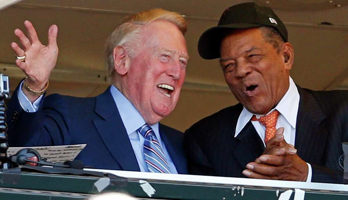 Los Angeles Dodgers broadcaster Vin Scully is applauded by San Francisco Giants’ Willie Mays during Scully’s final broadcast, Oct. 2, 2016, at AT&T Park.