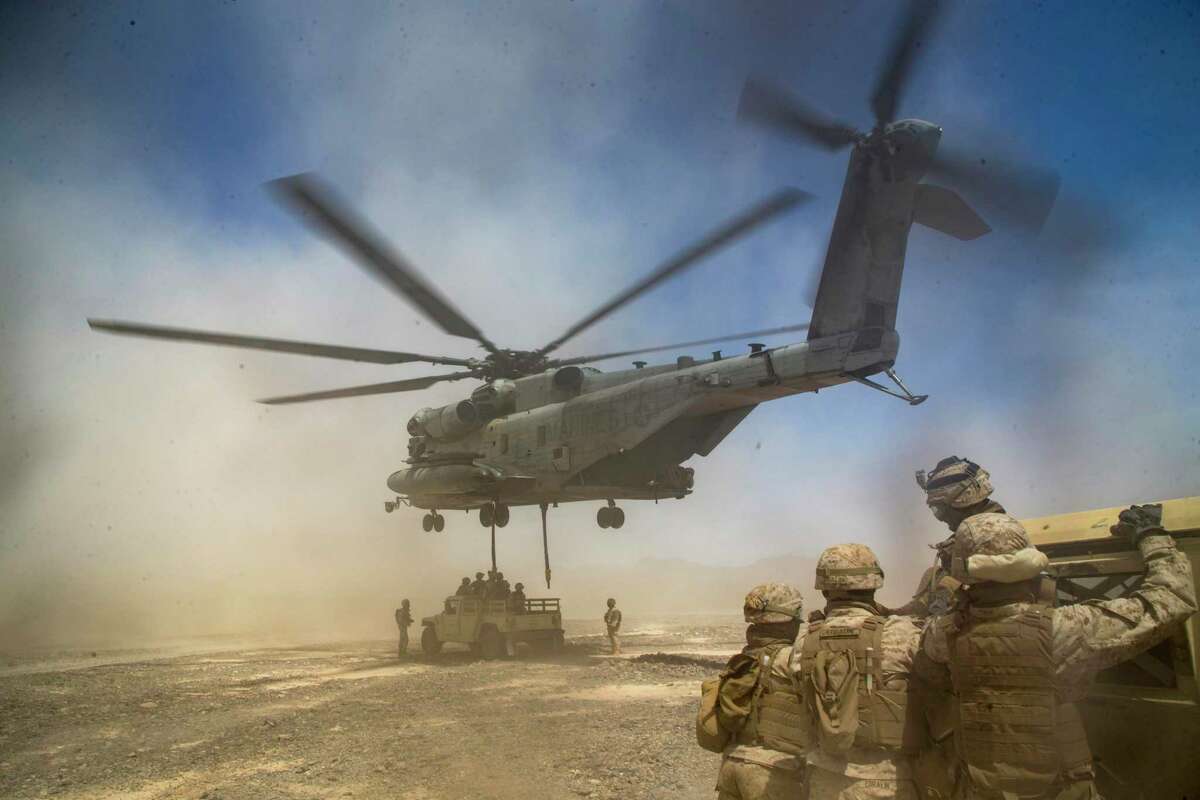 U.S. Marines with the 1st Marine Logistics Group prepare to rig a Humvee onto a CH-53E Super Stallion helicopter manufactured by Sikorsky, in early April 2021 at Chocolate Mountain Aerial Gunnery Range in California. Sikorsky is ramping up manufacturing for as many as 200 CH-53K King Stallion helicopters to replace the Super Stallion in the coming decade, with the King Stallion having triple the load capacity. (U.S. Marine Corps photo by Cpl. KarlHendrix Aliten)