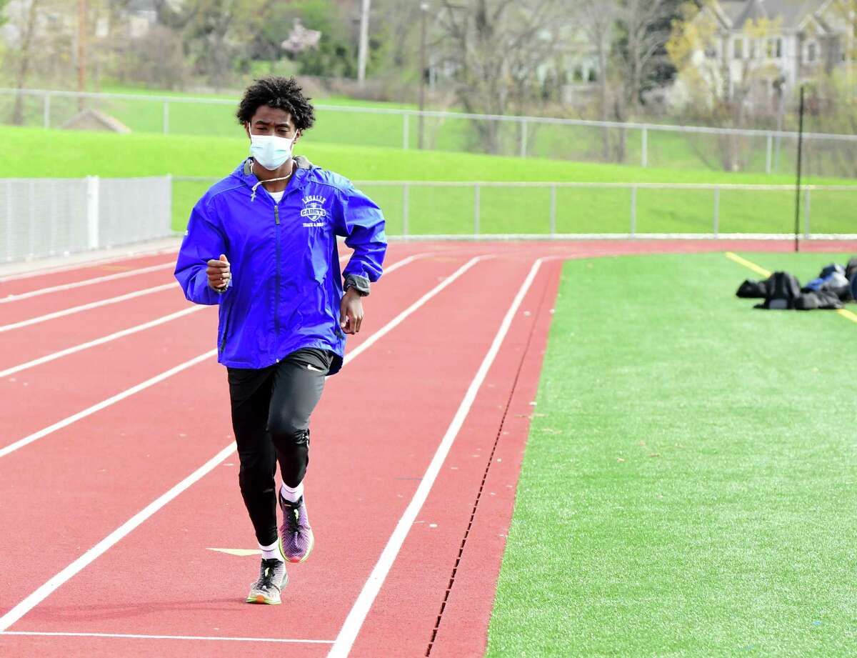 La Salle's Gitch Hayes warms up on the track before a race against Lansingburgh on April 20, 2021. Hayes was the top 1,600-meter runner in Section II and the Athlete of the Year in boys' track and field.