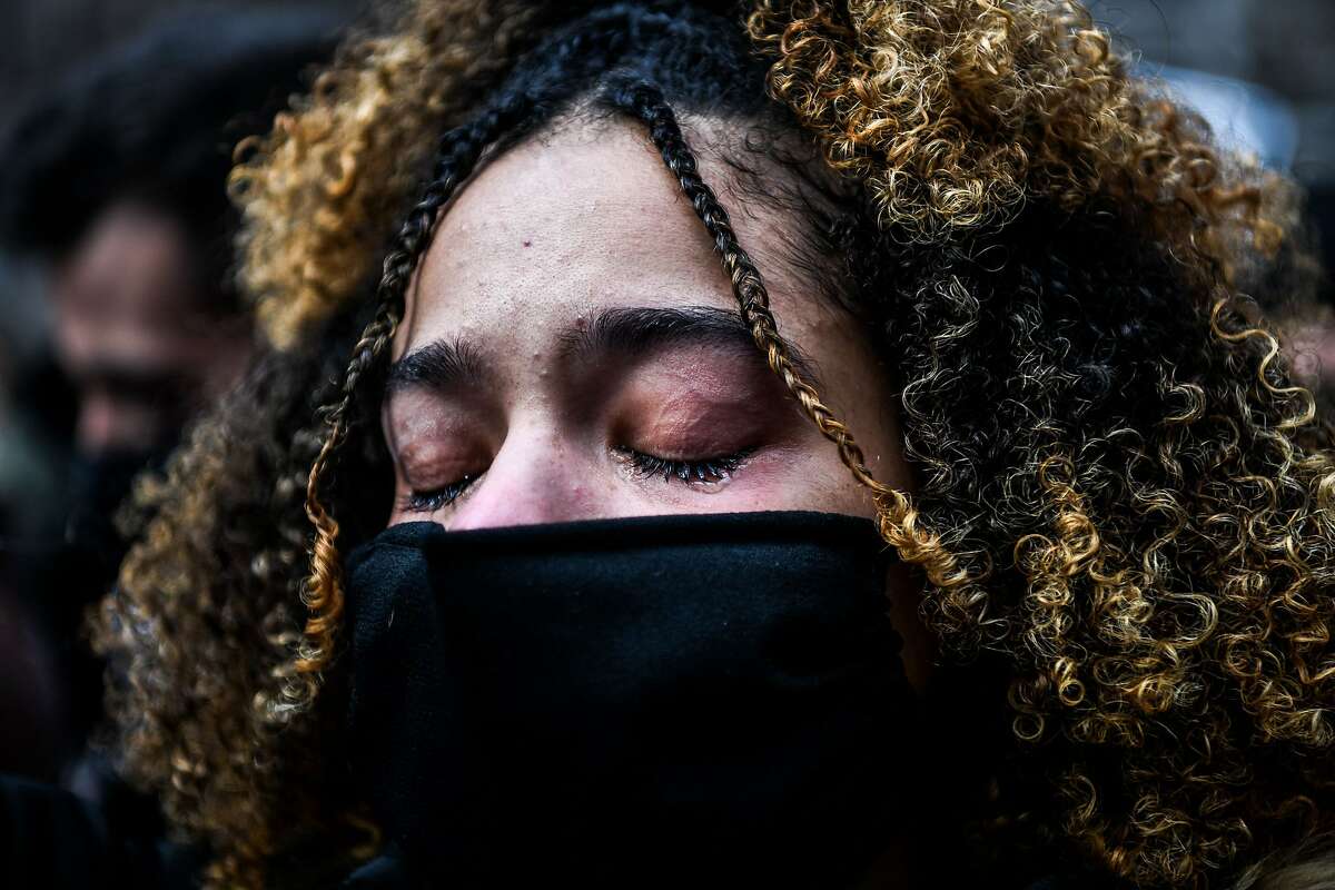 A woman cries as the verdict is announced in the trial of former police officer Derek Chauvin outside the Hennepin County Government Center in Minneapolis, Minnesota on April 20, 2021. - Sacked police officer Derek Chauvin was convicted of murder and manslaughter on april 20 in the death of African-American George Floyd in a case that roiled the United States for almost a year, laying bare deep racial divisions. (Photo by CHANDAN KHANNA / AFP) (Photo by CHANDAN KHANNA/AFP via Getty Images)