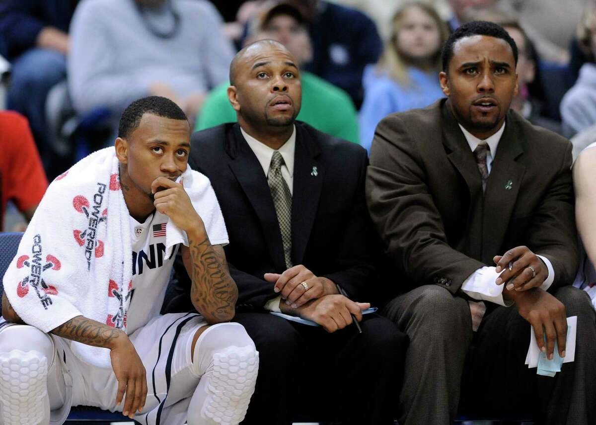 From left, UConn’s Ryan Boatright and coaches Ricky Moore and Kevin Freeman react late in a loss to Villanova in 2013.