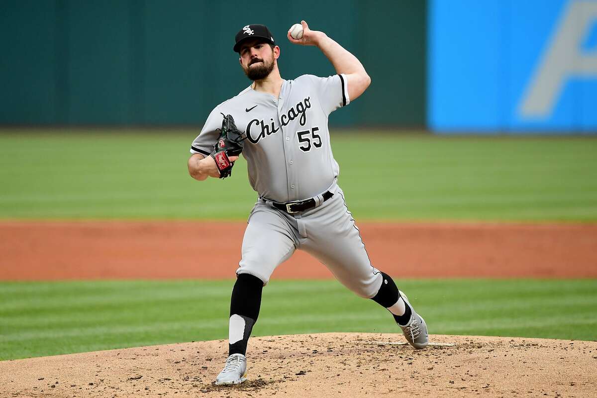 Chicago’s Carlos Rodon threw in short sleeves even as temperatures fell into the 30s in Cleveland.