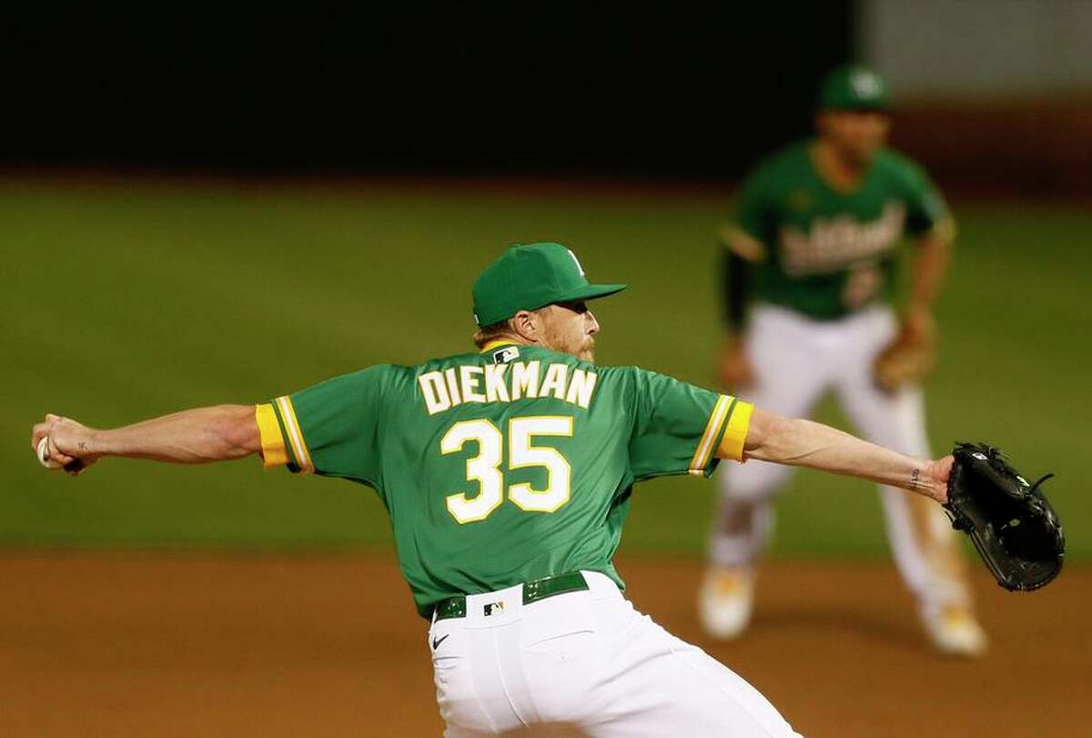 Oakland Athletics relief pitcher Jake Diekman (35) in the seventh inning during the second game of an MLB doubleheader against the Minnesota Twins at RingCentral Coliseum on Tuesday, April 20, 2021, in Oakland, Calif.