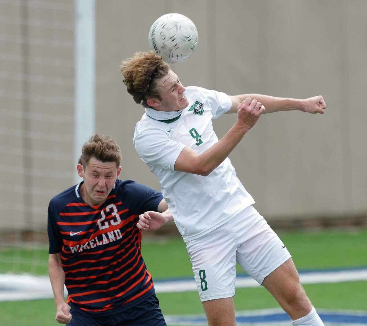 Kingwood Park forward Nathan Jimerson (8) heads the ball against Frisco Wakeland defender Jacob Rulon (23) in the first period of the UIL Class 5A boys soccer championship, Saturday, April 17, 2021, in Georgetown.