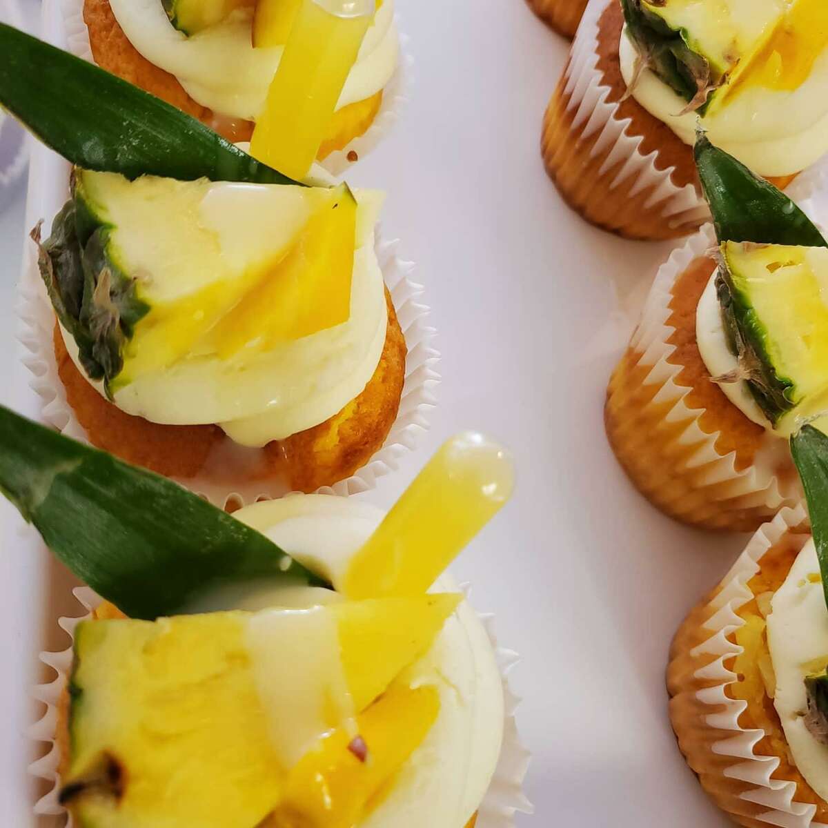 Mango coconut pineapple cupcakes from Edible Couture.