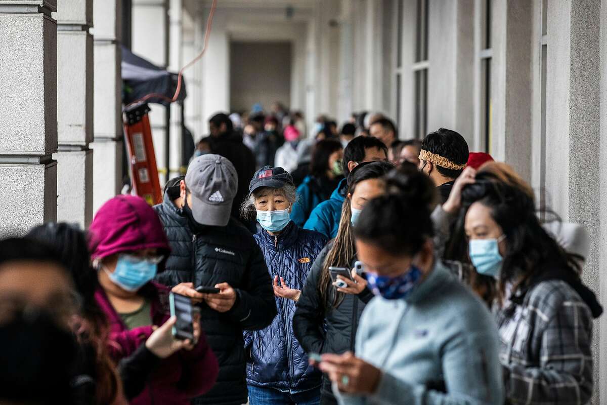 People wait outside H Mart during its long-anticipated grand opening in the Ingleside Heights neighborhood of San Francisco, California Wednesday, April 21, 2021.