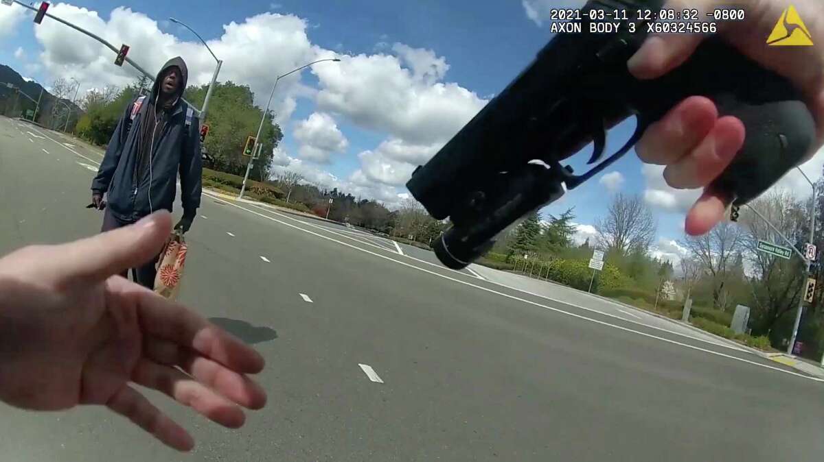 A screen grab from newly released body camera footage from Danville police Officer Andrew Hall’s body camera shows him about to fatally shoot Tyrell Wilson, 33, in the middle of an intersection on March 11.