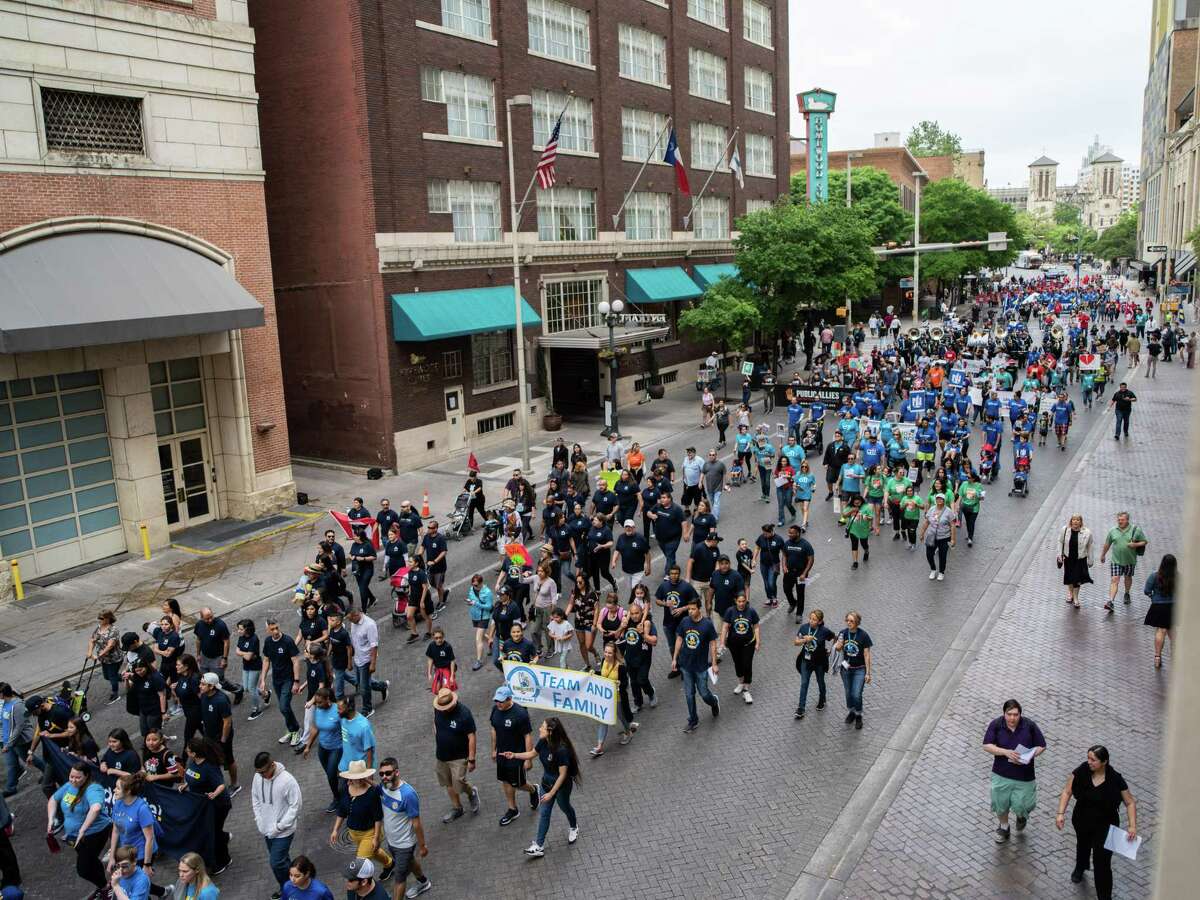 Marchers make their way into downtown San Antonio during the 23rd annual Cesar Chavez March on Thursday, March 28, 2019.
