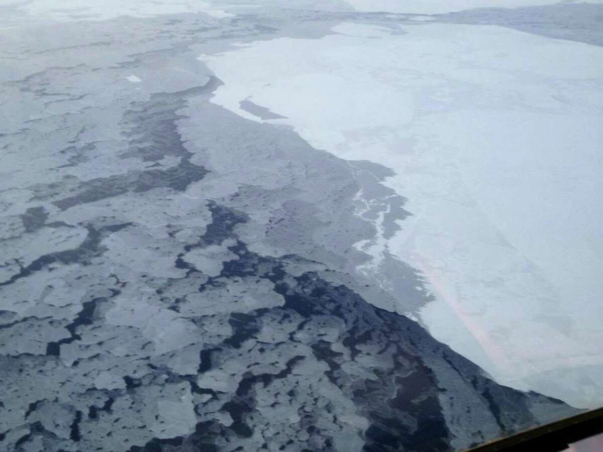 This handout photo provided by The National Oceanic and Atmospheric Administration (NOAA) shows Arctic sea ice in 2013. The Arctic isn't nearly as bright and white as it used to be because of more ice melting in the ocean, and that's turning out to be a global problem, a new study says. With more dark, open water in the summer, less of the sun's heat is reflected back into space. So the entire Earth is absorbing more heat than expected, according to a study published Monday in the Proceedings of the National Academy of Sciences. (AP Photo/NOAA)