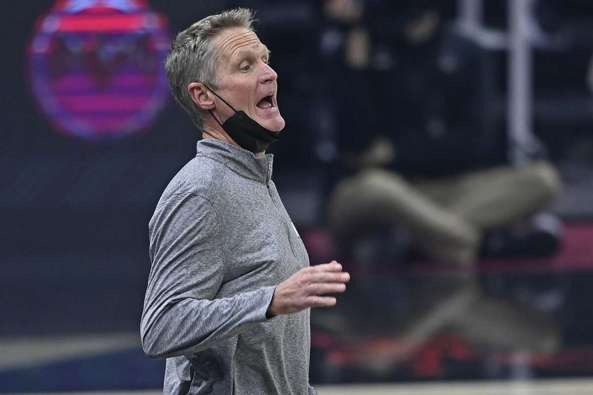 Golden State Warriors coach Steve Kerr calls a play in the first half of the team's NBA basketball game against the Cleveland Cavaliers, Thursday, April 15, 2021, in Cleveland. (AP Photo/David Dermer)