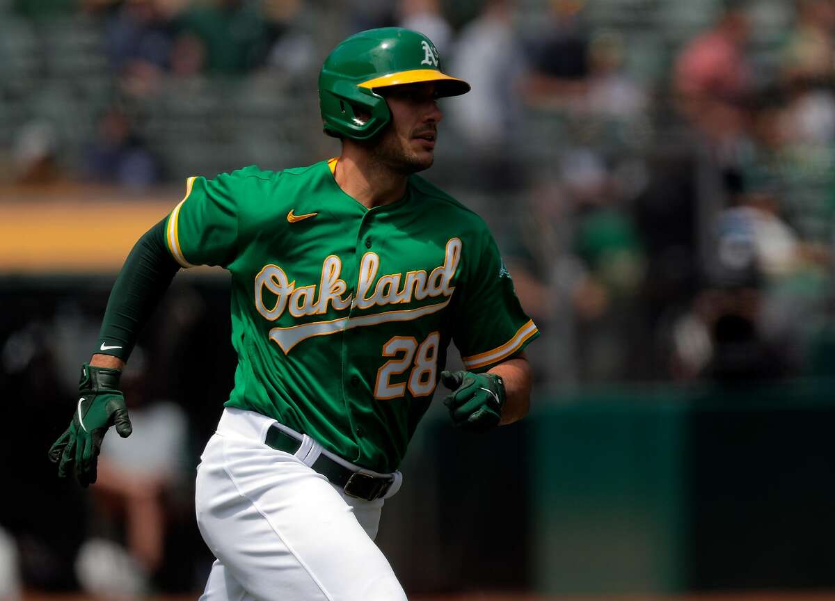 Matt Olson (28) rounds the bases on his solo homerun in the second inning as the Oakland Athletics played the Minnesota Twins at the Oakland Coliseum in Oakland, Calif., on Wednesday, April 21, 2021.