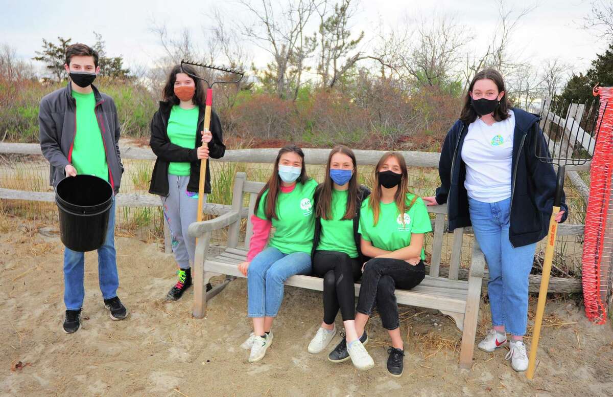 Members of the Environmental Action Club get some cleanup time in ahead of Saturday's annual beach cleanup event at Tod's Point beach in Greenwich, Conn., on Wednesday April 21, 2021. From left to right is Benjamin Cooper, Isabelle Harper, Annika Wolle, Genevieve McQuillan, Gabriella Meyerhoff and Caitlin O'Brien. The event is held in honor of their former classmate Luke Meyers, who died in 2019 after a 20-month battle with glioblastoma.