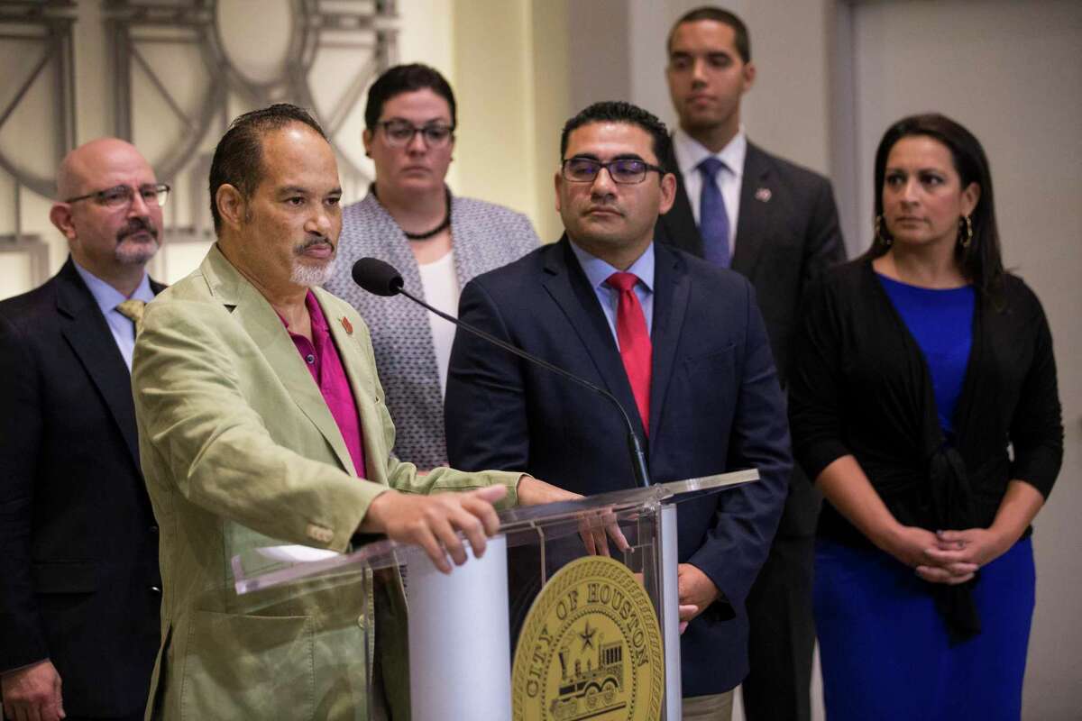 Rep. Garnet Coleman, standing with several members of the Texas House Democratic Caucus and others, speaks during a news conference to demand Gov. Greg Abbott to call a special session aimed at limiting gun violence on Wednesday, Sept. 4, 2019, in Houston.