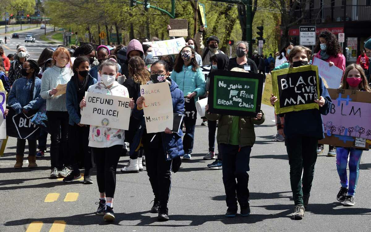 Students from Elm City Montessori School march for the Black Lives Matter movement on Whalley Avenue in New Haven on April 22, 2021.