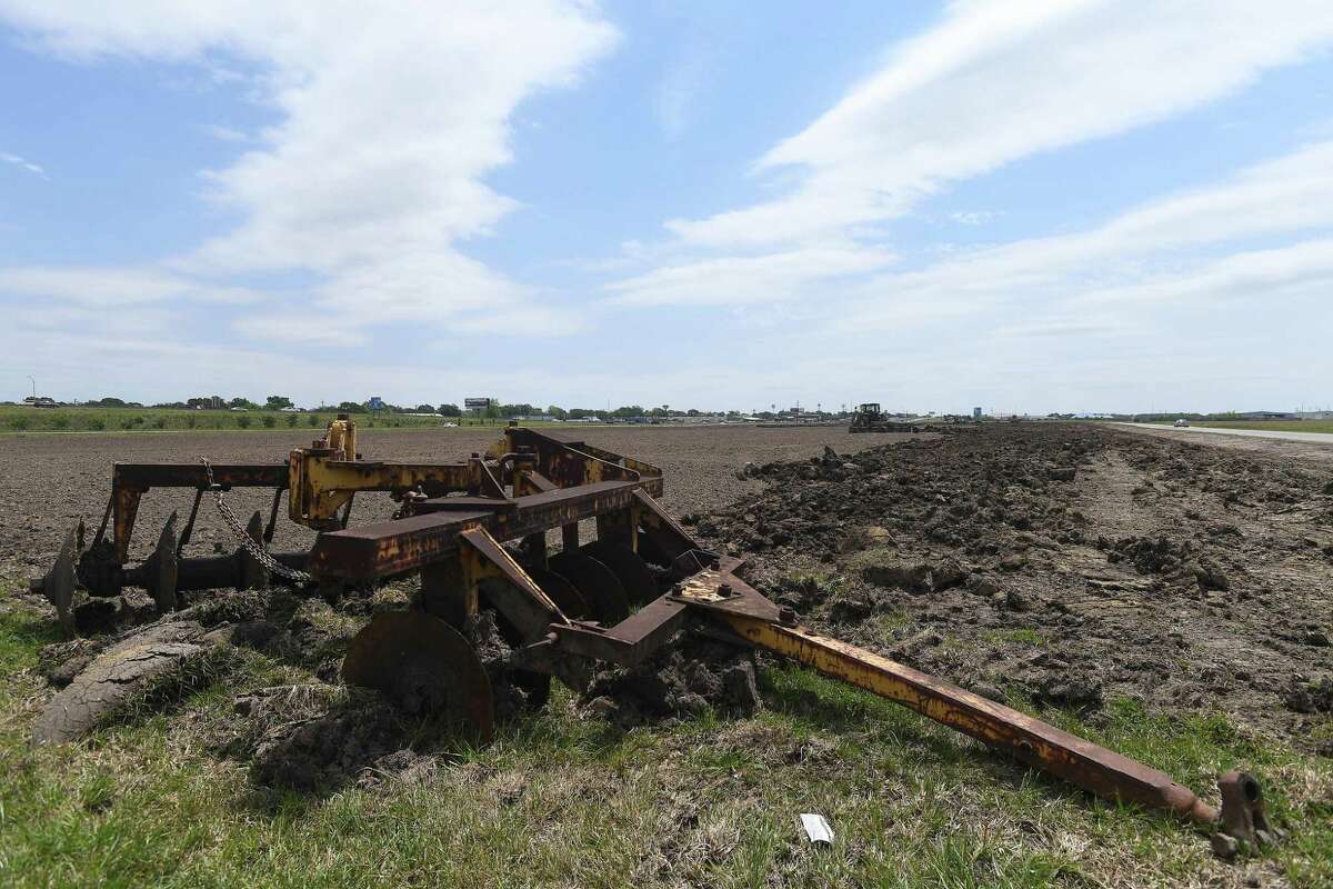 Workers continue to clear the ground and dig on the land along Highway 69 near the Jack Brooks Airport. The property has been available for commercial development for years. Photo made Thursday, April 22, 2021 Kim Brent/The Enterprise