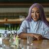 Mary Lou Davis, who is one of two finalists competing on “Hell’s Kitchen” for $250,000 and a job with Gordon Ramsay poses Wednesday at Whiskey Cake Kitchen and Bar, where she works as executive chef.