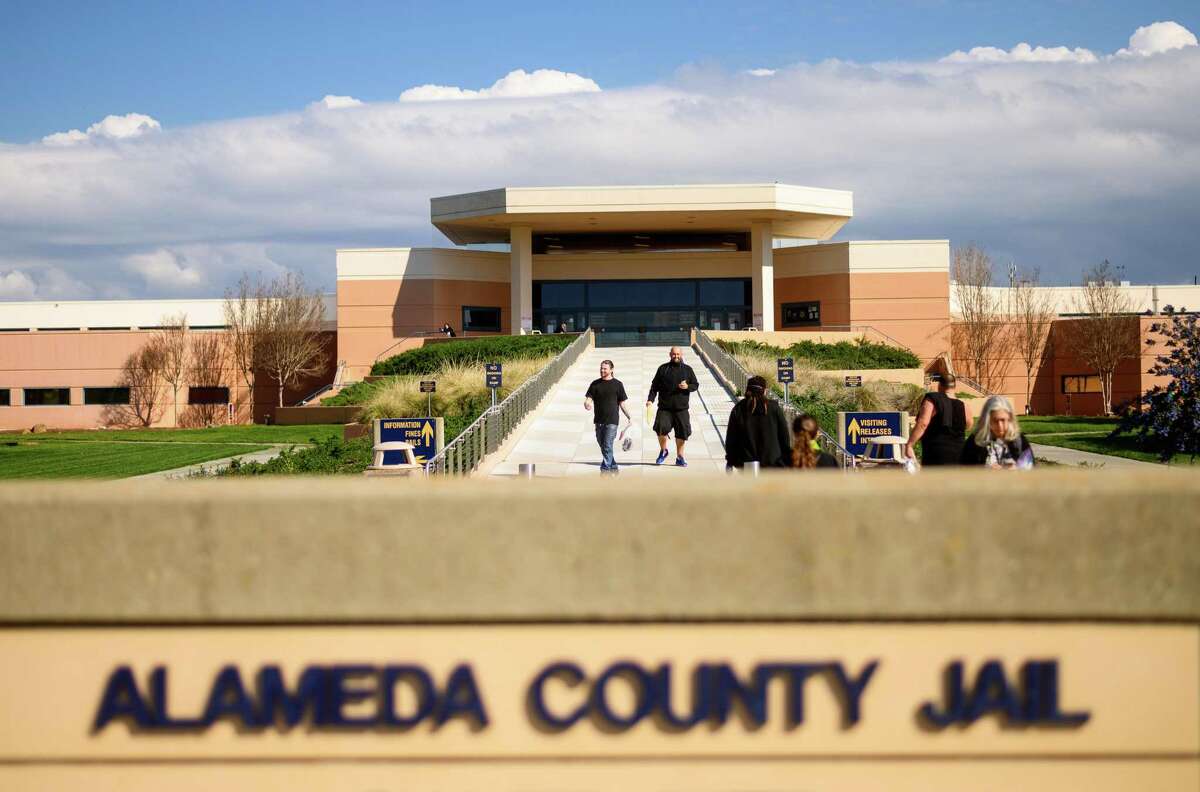 Two inmates leave Santa Rita Jail on March 20, 2020, in Dublin, Calif. They were among several hundred prisoners granted early release as the county tries to prevent coronavirus spread in a vulnerable population.