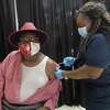 Port Arthur Mayor Thurman Bartie gets his second coronavirus vaccination from nurse LaTasha Mayon at the Civic Center Monday. Photo made Monday, April 5, 2021 Kim Brent/The Enterprise